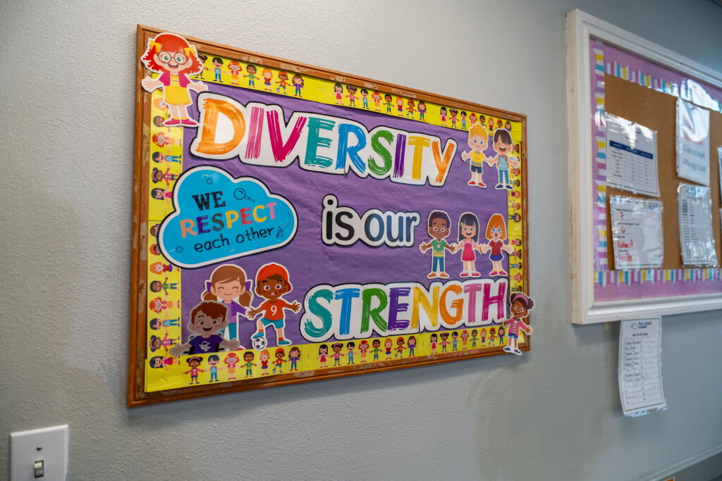 A classroom display board reading “Diversity is our strength”